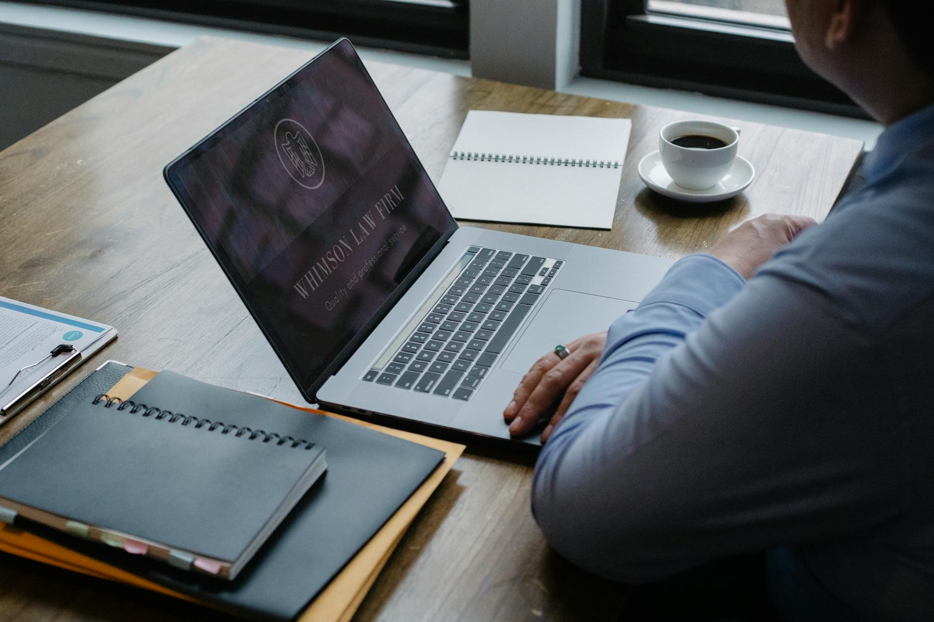 male entrepreneur working at laptop in workplace